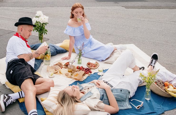 A group of people enjoying a rooftop picnic