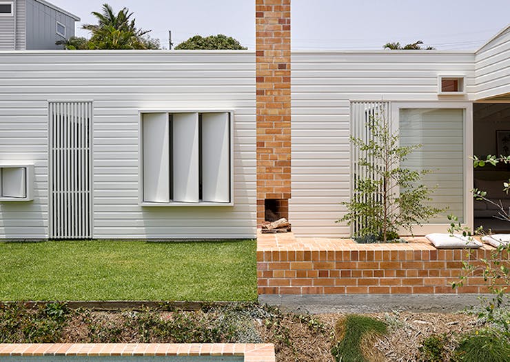 A shot of the white timber exterior of the Cantala Avenue house.