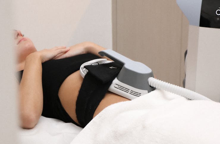 A person having the EMSCULPT treatment on their abs