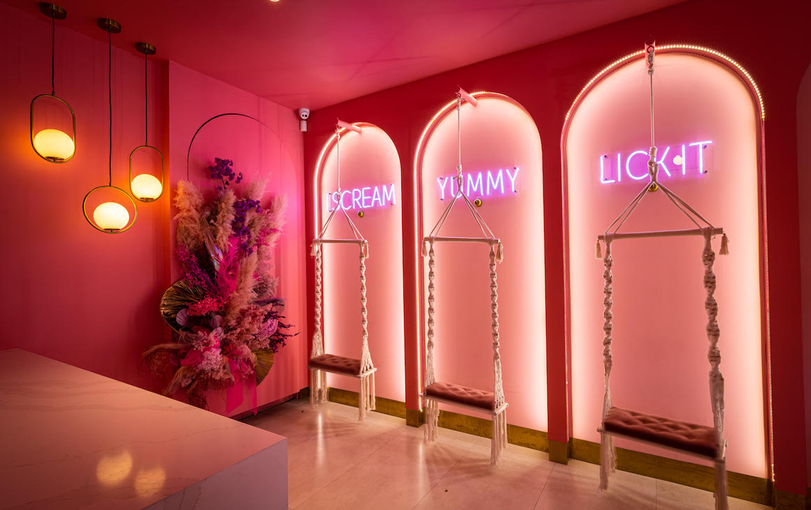 Interior of Fry'd Leederville with pink walls, arches and swings