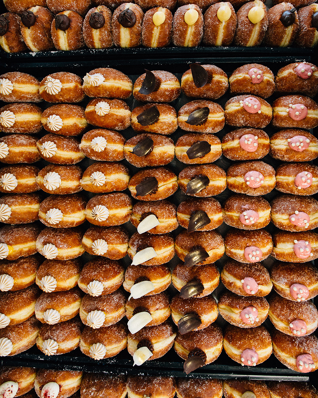 A dizzying array of freshly made doughnuts at Grownup Donuts.
