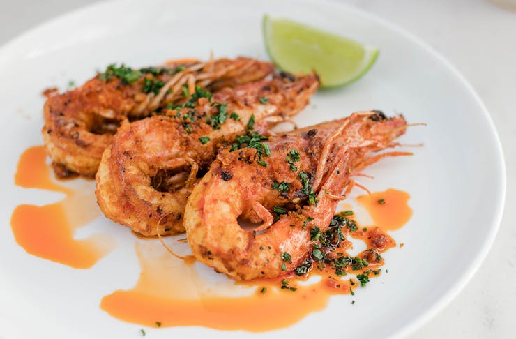 Grilled prawns on a plate.