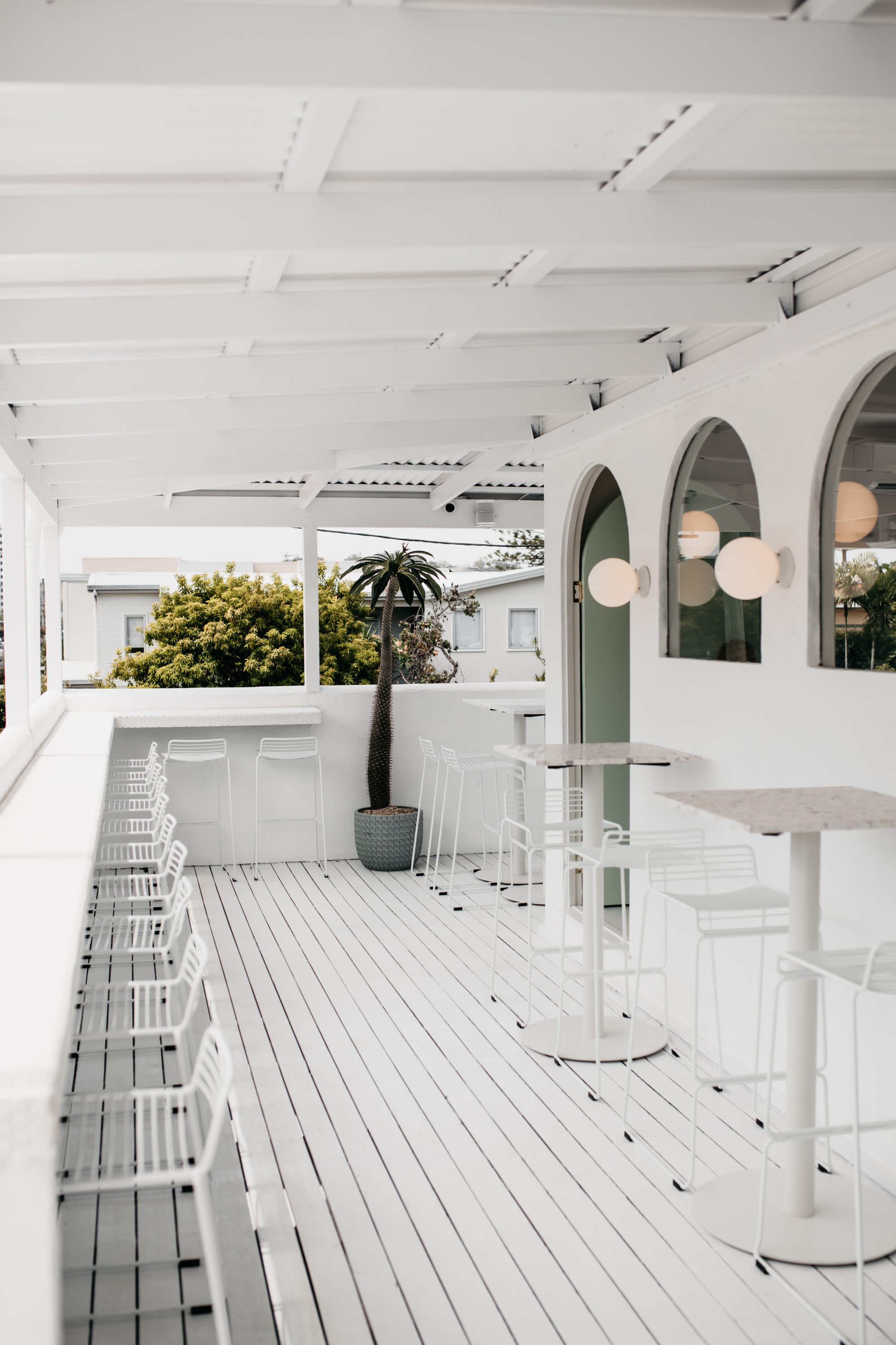 The white exterior deck of palm springs in burleigh