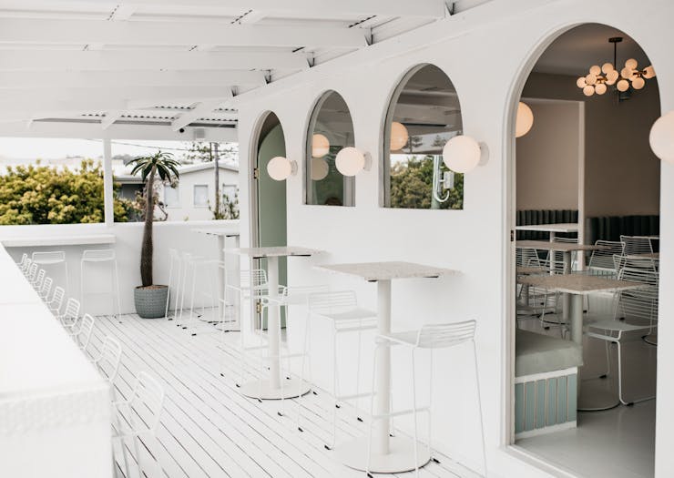 The whitewashed deck and archways of Burleigh's new Palm Springs cafe.