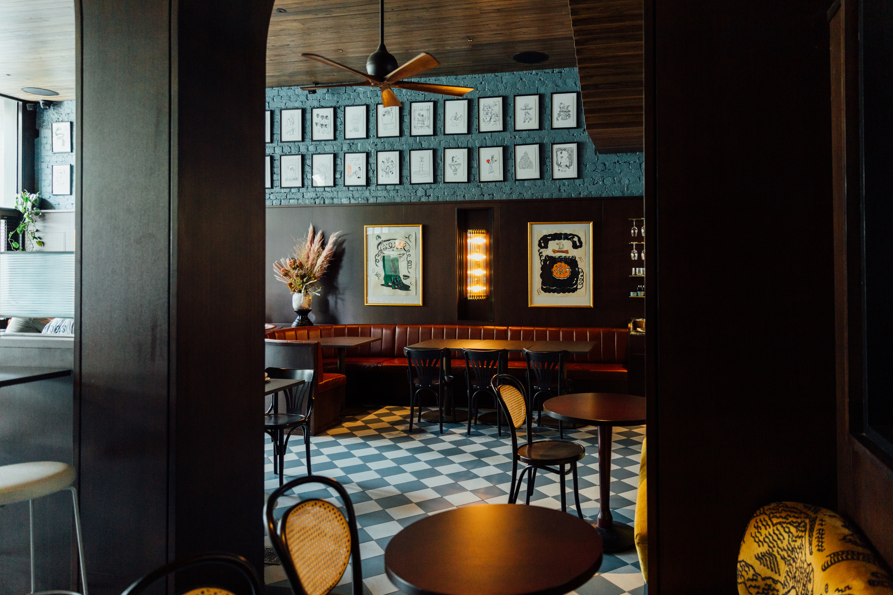 The interior of Poodle bar. Colorful tiles line the floor.