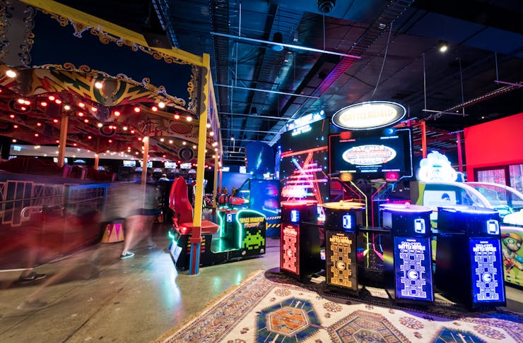 A bright and colourful gaming arcade.