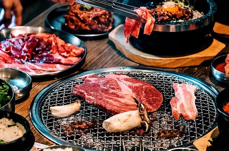 Various meats on the grill at a Korean BBQ restaurant in Sydney. 