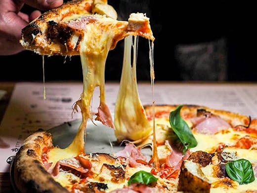 A cheesy parmigiana pizza.