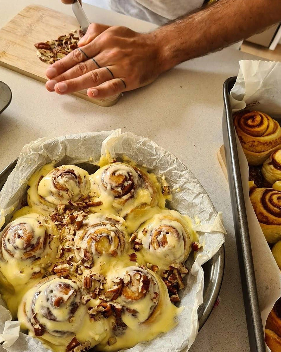 Someone prepares delicious cinnamon buns at Hill House Cafe.