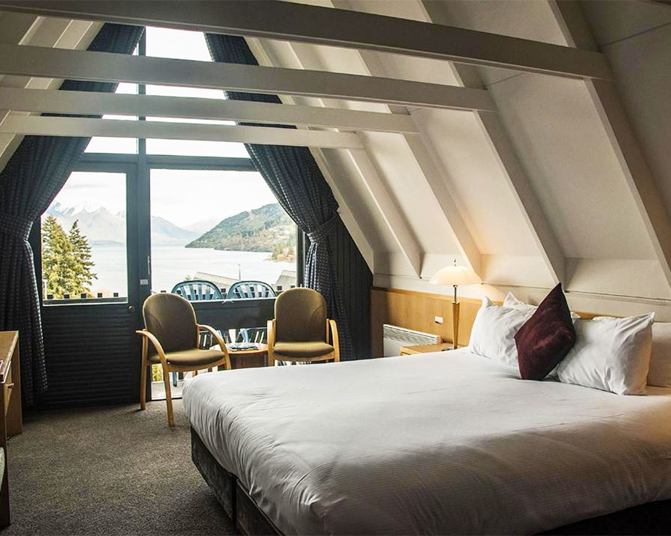 A bedroom in the eaves at the Heartland Hotel in Queenstown.
