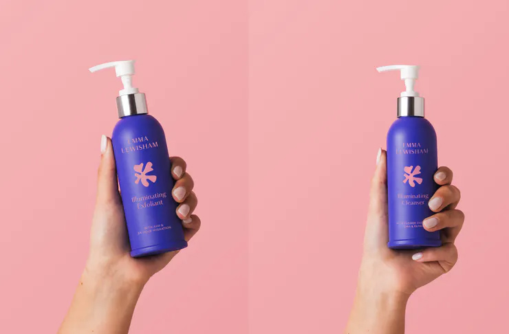 Two hands hold up the illuminating oil cleanser and the illuminating exfoliant.