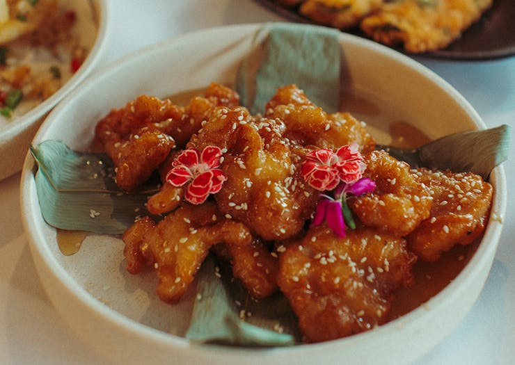 a plate of crunchy chicken in sauce