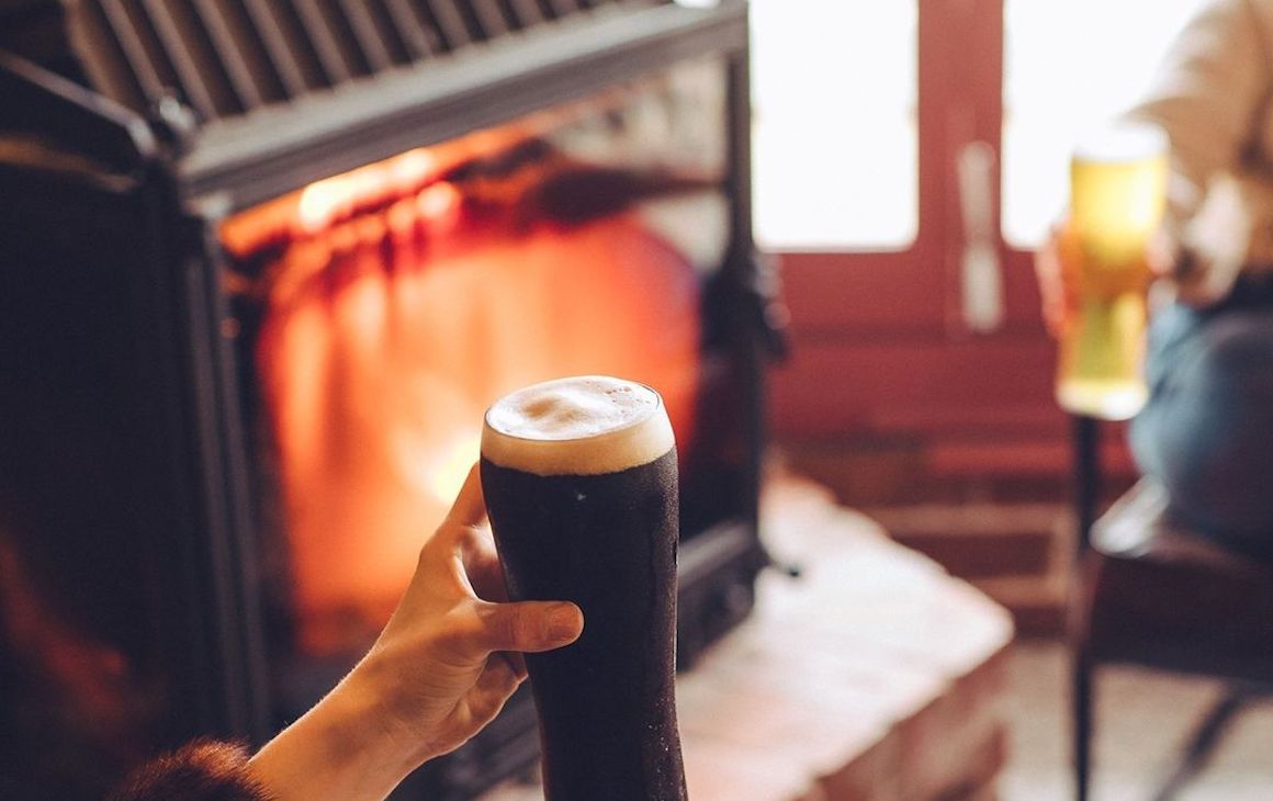 Image of a beer in front of the fireplace at Mr Chapple