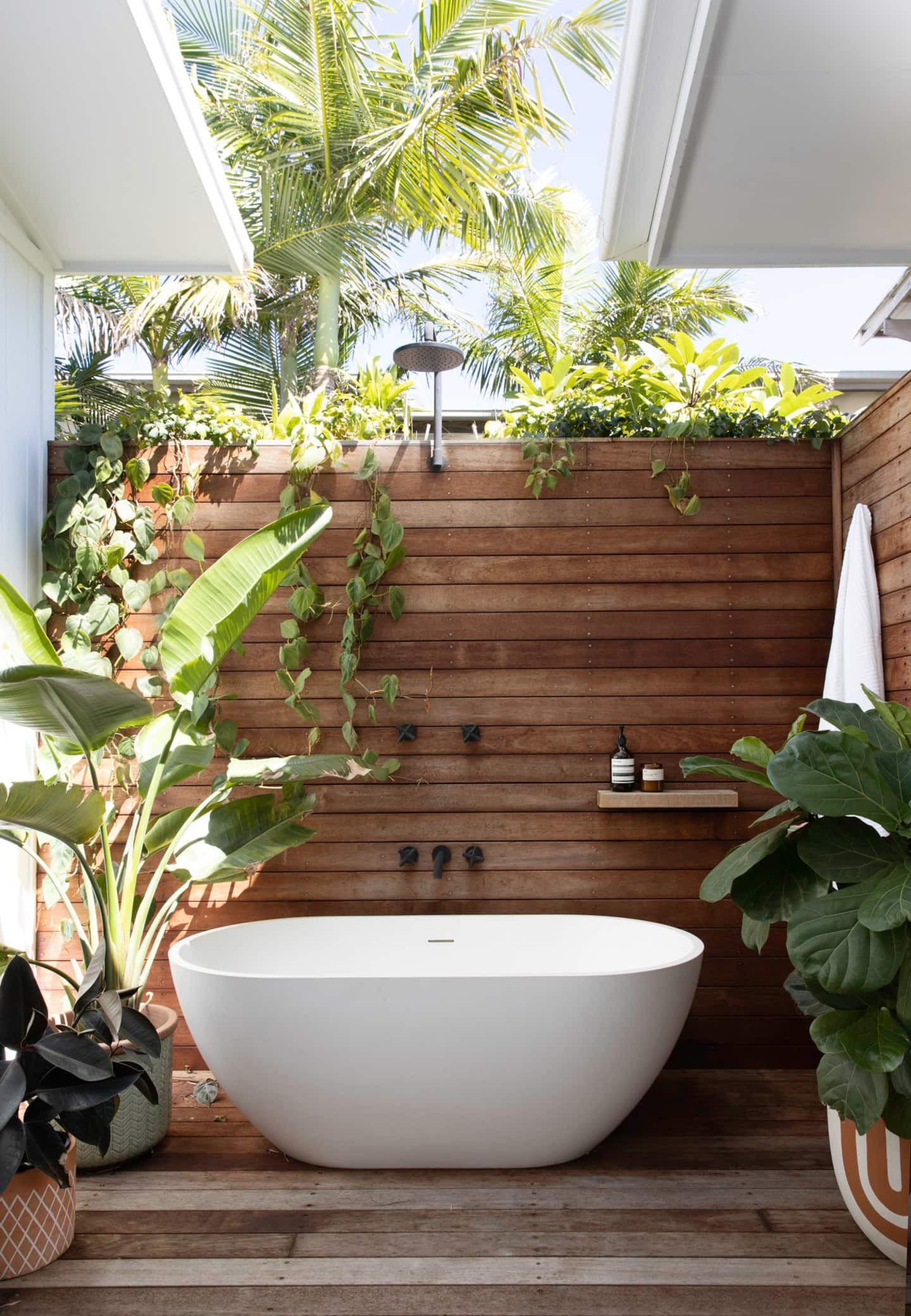 a bath outside surrounded by greenery