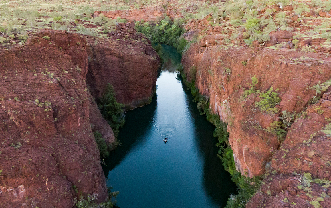 a kayak in a wide, river-filled gorge