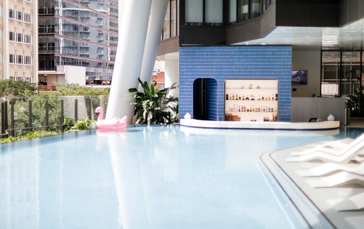 the-westin-s-epic-swim-up-bar-is-throwing-pool-parties-all-summer