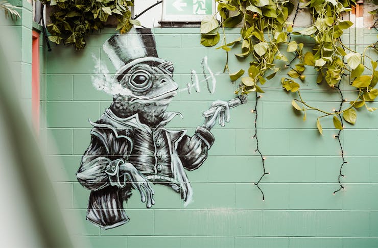 another mural of a frog wearing a top hat