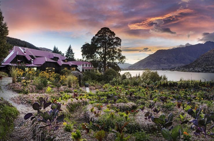 The exterior of the Sherwood in Queenstown at dusk.