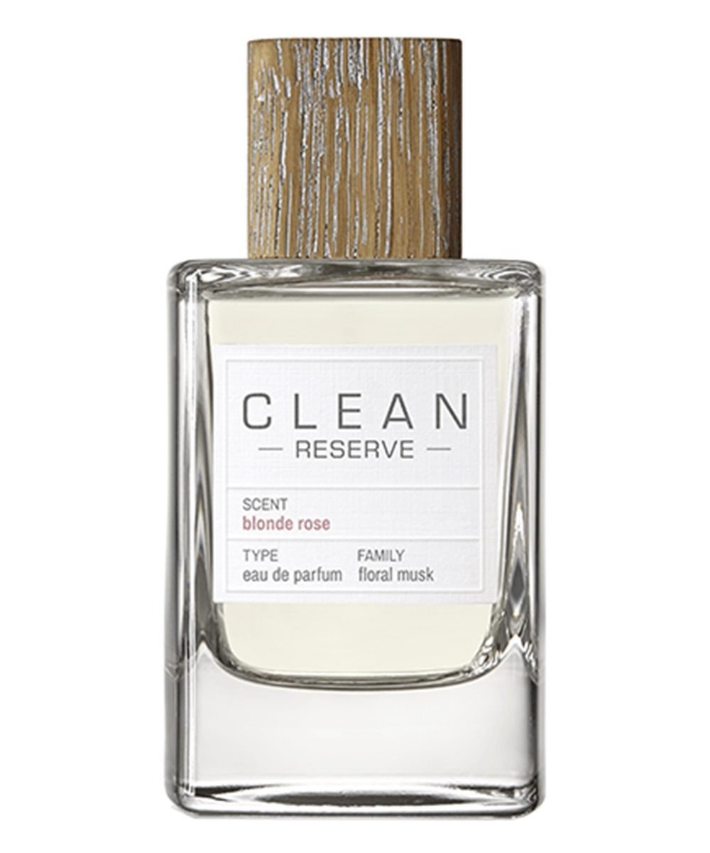 a transparent perfume bottle with a white label.