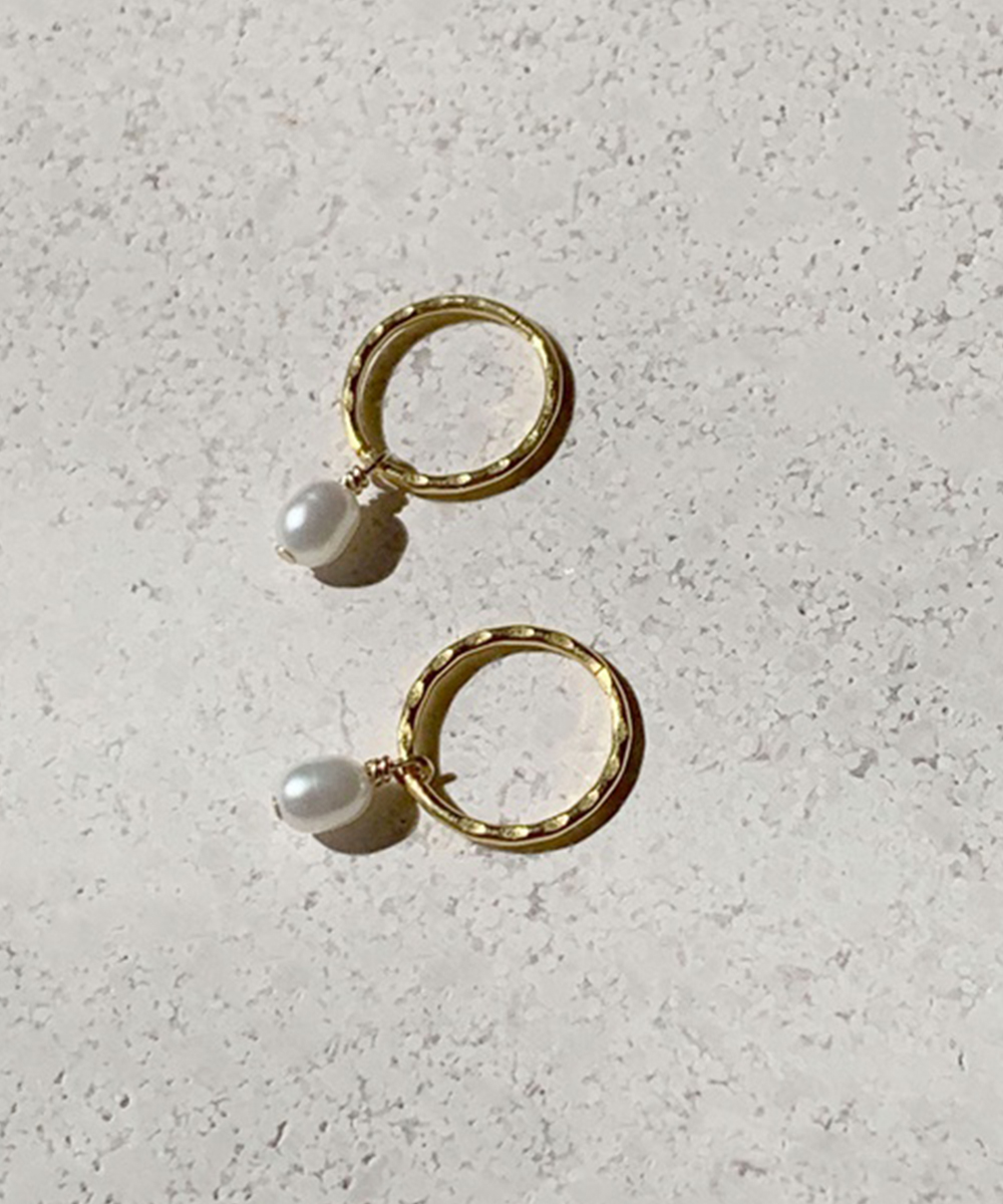 a pair of small hoops with pearls attached