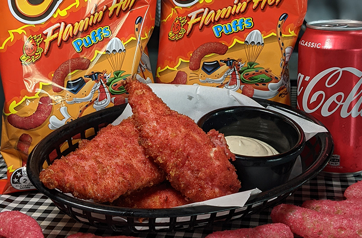 This Burger Joint Just Dropped Flamin’ Hot Cheetos Chicken Tenders ...