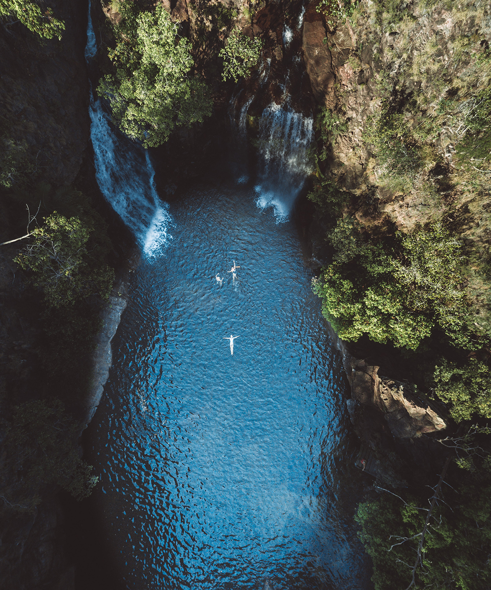 two people float in the water at Florence Falls