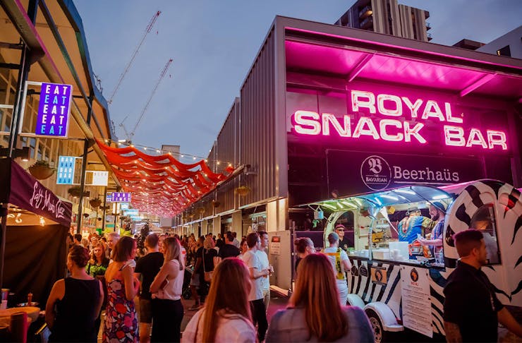food market stalls with bright neon lights
